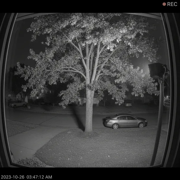 An external infrared illuminator providing night vision for a window-mounted security camera without glare